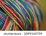 Small photo of Colorful strings close up rolled up together. Rainbow, linen or cotton string. Thick thread.