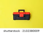 Mini tool box top view isolated on yellow background. 