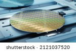 Small photo of Close-up Shot of Silicon Wafer in Bright light at Advanced Semiconductor Foundry, that produces Computer Chips.