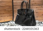 Small photo of Paris, France - February 18 2023 : Rare Handbag Hermes Birkin So Black 30 cm in Black calfskin leather