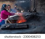 Small photo of sourdough Tandoori bread. Tandoori Bread Kurdish women who mardin turkey may 2023