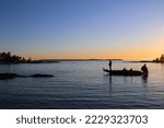 Small photo of Fishing for pike with high speed bass boat in the sunset. Fisherman casting in the last rays of light, on Lake Vanern. Scandinavia, Sweden.