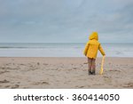 Boy In Yellow Raincoat On A...