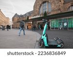 Small photo of AACHEN, GERMANY - NOVEMBER 8, 2022: Tier Mobility logo on an electric scooters in of Aachen Hauptbahnhof. Tier is a german transportation company specialized in dockless electric scooters sharing
