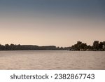 Small photo of Panorama of the reka Sava river between belgrade and obrenovac, in Serbia, with a couple of splav, serbian raft floating houses, at dusk. Sava is a Balkans river.