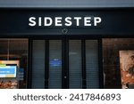 Small photo of COLOGNE, GERMANY - NOVEMBER 6, 2022: Sidestep logo on a close store in Cologne. Sidestep was a footwear chain of stores specialized in shoes now closed and defunct.
