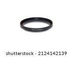 Small photo of Step up ring for 49mm to 52mm lens filters with isolated white background