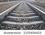 Railway lines with track ballast. Train tracks underlay, rails and crushed stones. Industrial landscape. Railway junction. Heavy industry. Railway track.                      