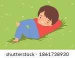 cute boy lying down on green... | Shutterstock .eps vector #1861738930