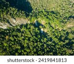 Small photo of aerial view the beautiful sun shine on the mountain top of Thi Lor Su waterfall the beautiful sun shine on the perfect forest of Thi Lor Su waterfall. the pristine beauty of Tak Thailand