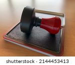 Red Handle Rubber Stamper On...