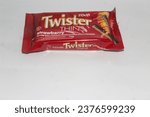 Small photo of Banyuwangi, Indonesia, May 1 2023: Twister thins wafer roll snacks with cream inside in attractive colored packaging on a white background