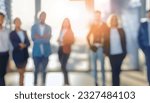 Defocused bokeh effect positive concept background of unrecognizable people diverse business team meeting of young professionals corporate startup