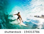 Surfer On Blue Ocean Wave In...