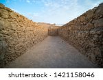 Small photo of View to the old stone blind alley. Architecture of ancient civilization. Masada paths and passages, Israel. Labyrinth dead-end. Concept of deadlock. Be at deadlock. Searching for way out in labirinth.