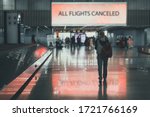 People leave the airport. girl walks through airport terminal. All flights are canceled. Ban on departure and arrival of aircraft due to covid-19 outbreak. Problems and crisis in aviation industry.