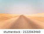 Landscape view of dusty road going far away nowhere in Wadi Rum desert,