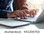 Businessman s hands typing on laptop keyboard in morning light (computer, typing, online)
