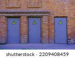 A Brick Wall With Three Purple...