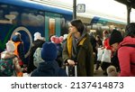Small photo of BOHUMIN, CZECH REPUBLIC, MARCH 17, 2022: Refugees Ukraine children family arriving boarding people board train Bohumin central station relief, mother bench baby waiting, luggage bags Russia war