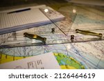 Small photo of Nautical chart, parallel ruler and triangle close up detail