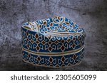 Small photo of A traditional Omani cap in beautiful colors called kumma , which is part of the Omani traditional costume