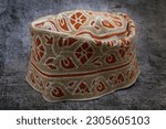 Small photo of A traditional Omani cap in beautiful colors called kumma , which is part of the Omani traditional costume