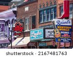 Small photo of Robert's Western World, Layla's Bar and The Second Fiddle sign on Broadway in Nashville, Tennessee on May 30th, 2022.