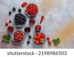 Small photo of Assortment of summer seasonal berry and fruits jams in small jars, homemade preserving concept, marmalades or confitures with fresh berries jam jar, mix jam, various jams, type jam, different jams.