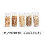 Small photo of Plastic Dry Fruit standup pouch on isolated white Background. Different types of nuts in packages on white background