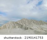Small photo of Kaolin quarry, view of industrial clay hills, environment after mining. Pile of Kaolin near of Kaolin lake in Belitung.
