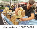 Small photo of LONDON - SEPTEMBER 7, 2013: English Blue Stilton cheese for sale at Broadway Market, Hackney