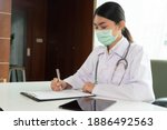 doctor in uniform working on... | Shutterstock . vector #1886492563