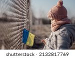 Girl holding Ukrainian flag, asking for peace, children against war, kids in danger, freedom, stop fighting, Blue Yellow