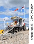 Small photo of Littlehampton, West Sussex, UK - May 28, 2022: Lifeguards exercise at a coastal lifeguard hut on the beach in Littlehampton, West Sussex