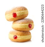Small photo of freshly baked jelly donuts stack isolated on white background