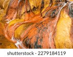 Small photo of Colorful orange abstract of a natural mineral hot spring mount from Pinkerton Springs in Durango Colorado