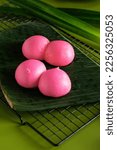 Small photo of Pink steamed bun. The traditional chinese steamed cake " Mi ku" is an importat cake during praying ceremonies as offerings to Chinese Gods. Selective focus.