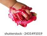 Red baby child's hand holding a ...
