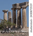 Small photo of Ancient Corinth, Greece - Aug 30, 2023: Temple of Apollo ruins in Ancient Corinth, Greece. Details of columns, pillars, doric architecture.