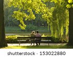 Two People Sitting On The Bench ...