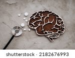 Small photo of A stethoscope and brain with pills. Awareness of Alzheimer's, Parkinson's disease, dementia, stroke, seizure or mental health.