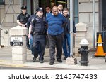 Small photo of NEW YORK, NEW YORK,USA - APRIL 13, 2022: Suspect Frank James is led by police from Ninth Precinct after being arrested for his connection to the mass shooting at the 36th St subway station.