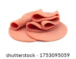 Small photo of Sliced of bologna sausage rolled and heap on white isolated background with clipping path. Bologna sausage origin from Italian, have delicious taste for sandwich or ABF. Delicatessen concept.
