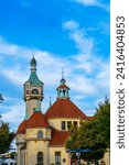 Small photo of Sopot, Poland - September 7 2022: Zaklad Balneologiczny Rehabilitacji and Sopot Lighthouse tower. Landmarks on late summer evening.