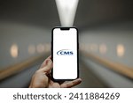 Small photo of Stuttgart, Germany - 09-22-2023: Mobile phone with logo of Centers for Medicare and Medicaid Services (CMS) on screen in front of website. Focus on center-left of phone display.