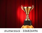 throphy in front of the red... | Shutterstock . vector #336826496