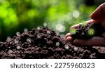 Small photo of Monitor soil quality to control soil quality, soil composition concept of smart farm agricultural economic development. And there are technology icons about the composition of the soil around it.
