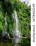 Small photo of Beautiful and scenic view of Asik-asik Falls in Alamada, Cotabato, Philippines. Water from this waterfalls comes directly from the wall of a towering mountain.