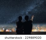 Silhouette Of Couple Sit On...
